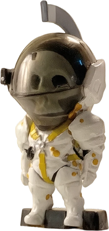 A small Ludens figure, the Kojima Productions mascot in a white suit and dark visor, hanging by a thin black string from a push pin