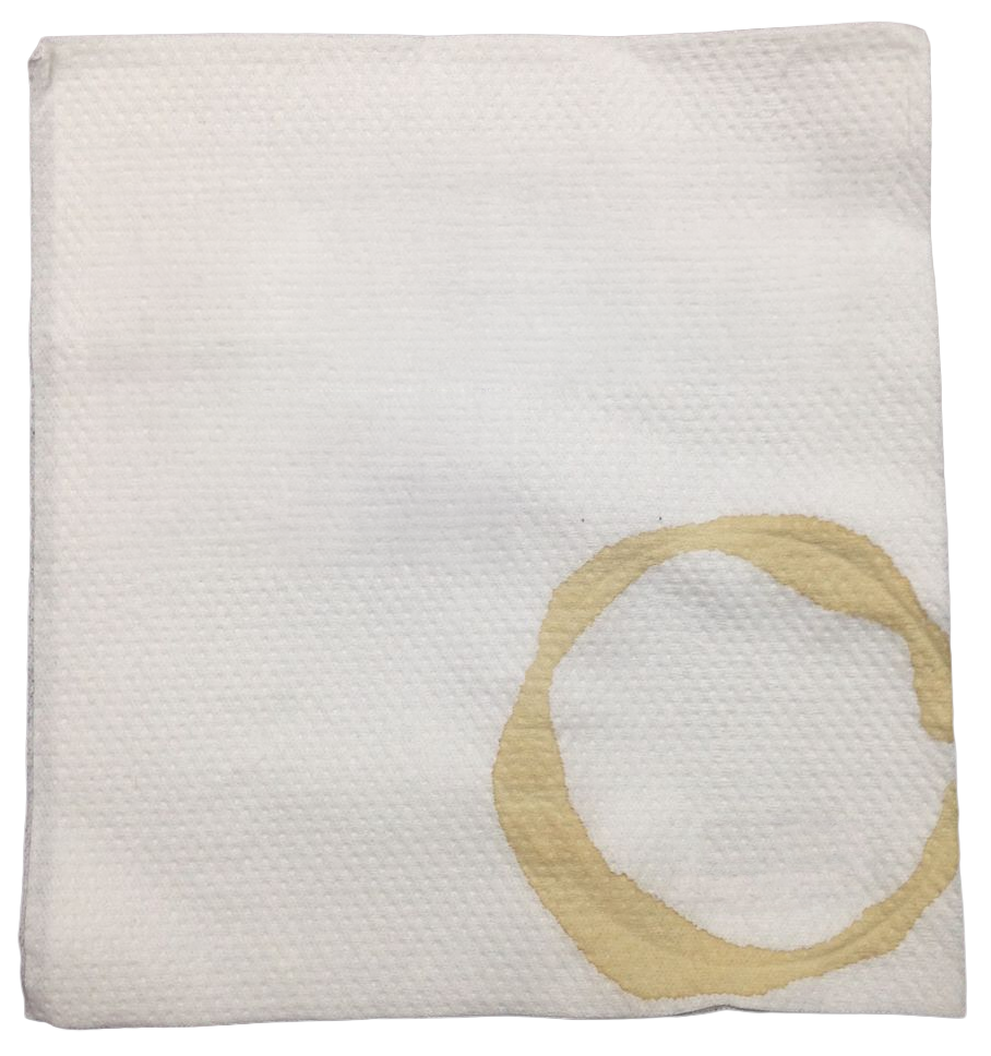 A plain white paper napkin with a coffee cup ring stained into one corner