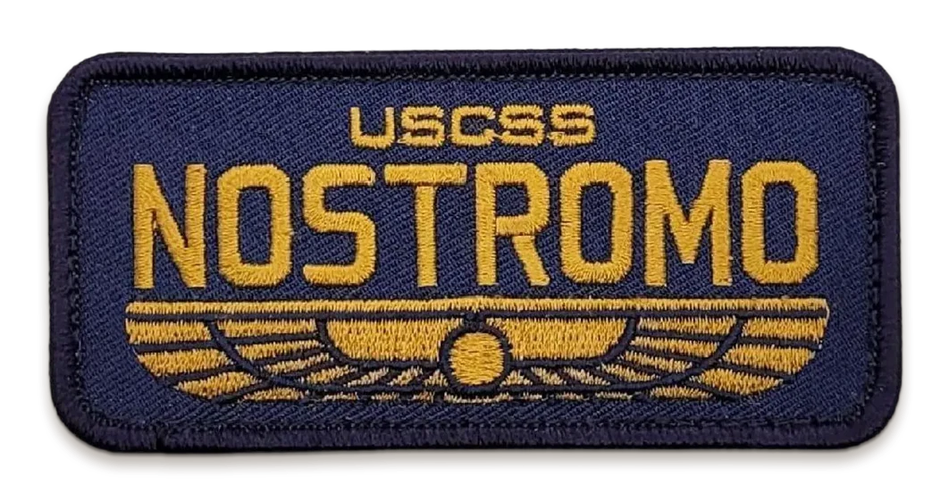 An embroidered navy USCSS Nostromo crew patch, the ship's name in gold over a winged emblem